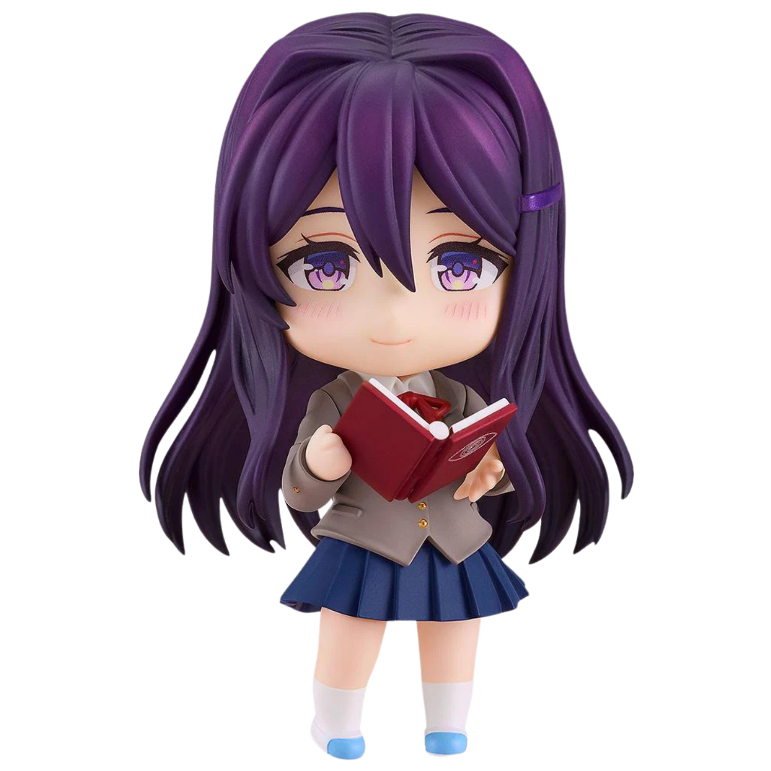 Figurine of a character with purple hair and a school uniform holding a red book on a white background
