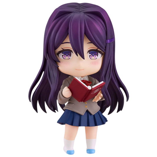 Figurine of a character with purple hair and a school uniform holding a red book on a white background