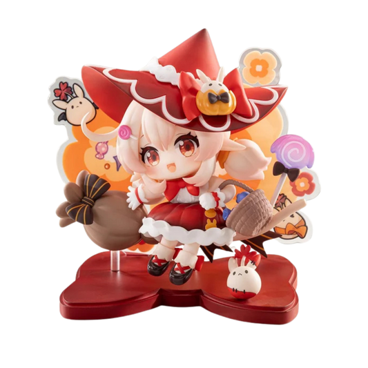 A stylized collectible figurine of a cute fantasy girl character in a red witch hat and red dress, posed with a brown sack, basket, and small white rabbit on a red display base against an orange illustrated backdrop.