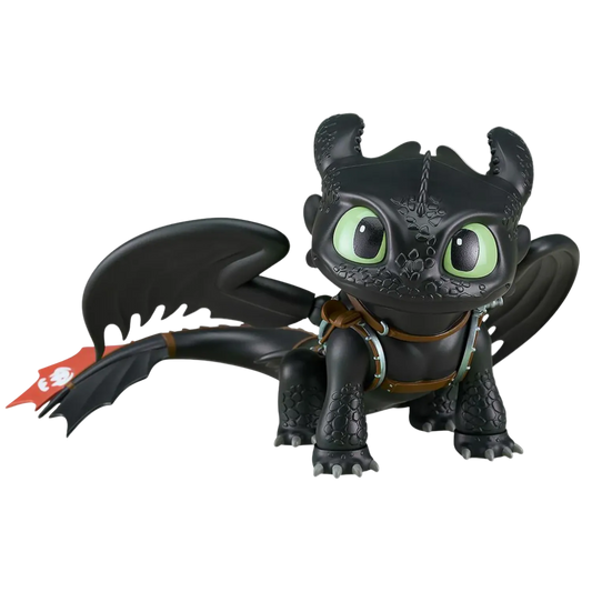 Black dragon toy figure with green eyes on a white background