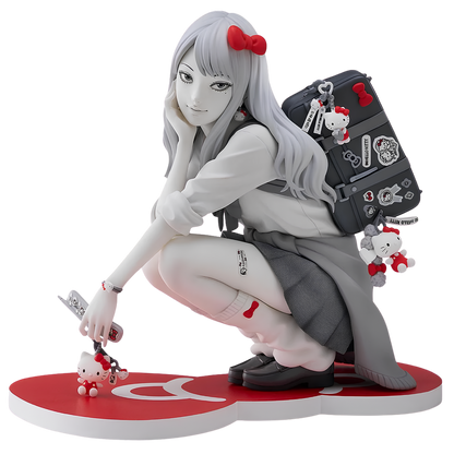 A detailed anime-style collectible figure of a girl with long silver hair and red bows, crouching on a red heart-shaped base. She wears a white long-sleeve top, dark gray pleated skirt, and black backpack decorated with stickers and Hello Kitty-themed accessories, including a small Hello Kitty figure.