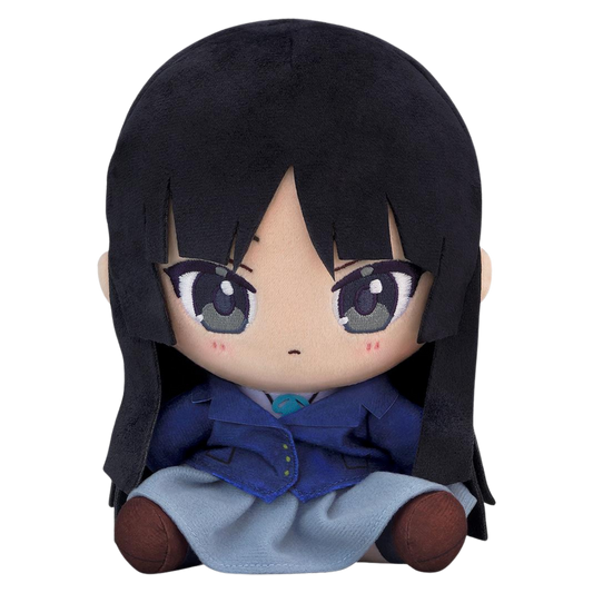 A chibi-style plush doll with long black hair, large gray eyes, and a blue-and-gray outfit, photographed against a plain white background.