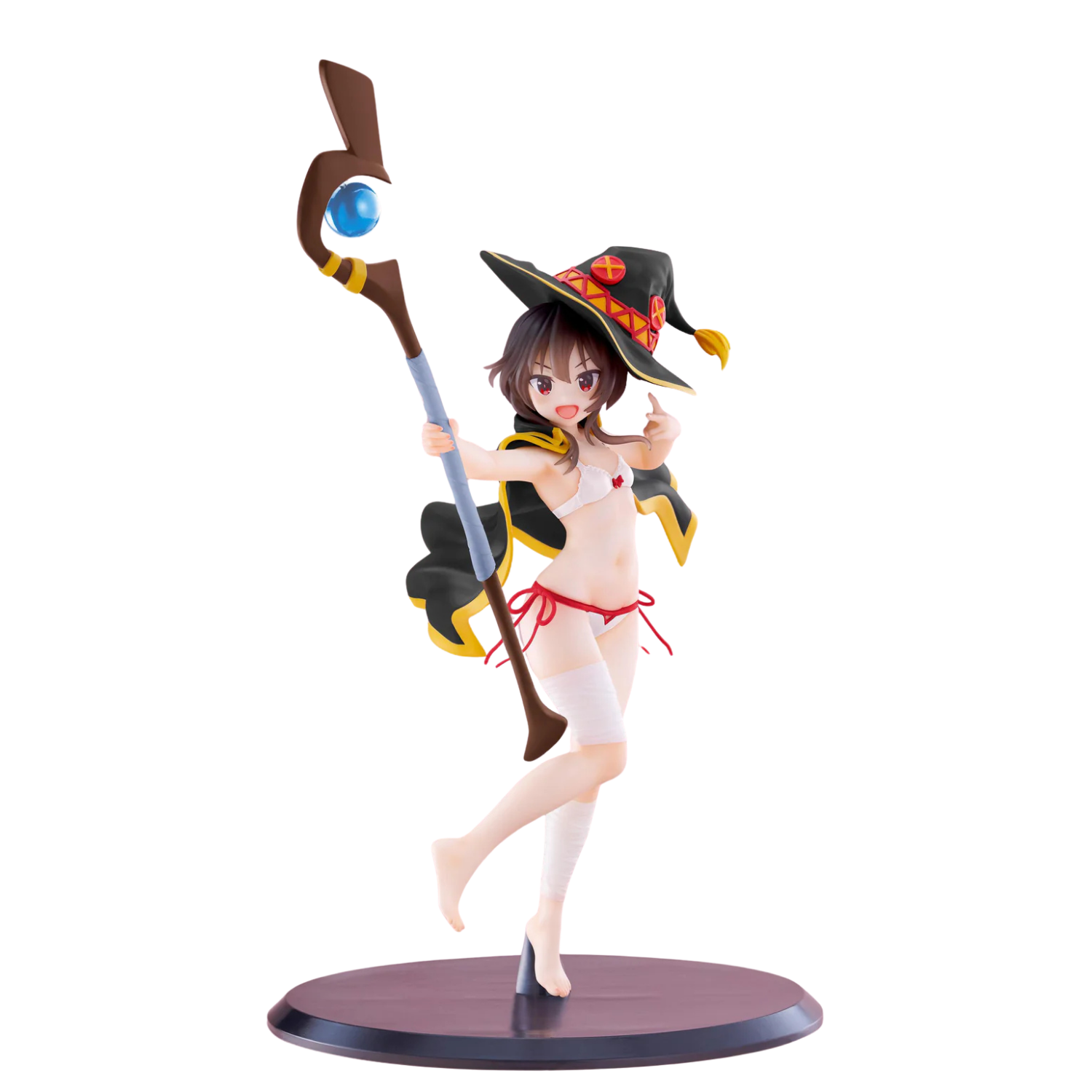 Figurine of a character in a witch outfit with a staff on a white background