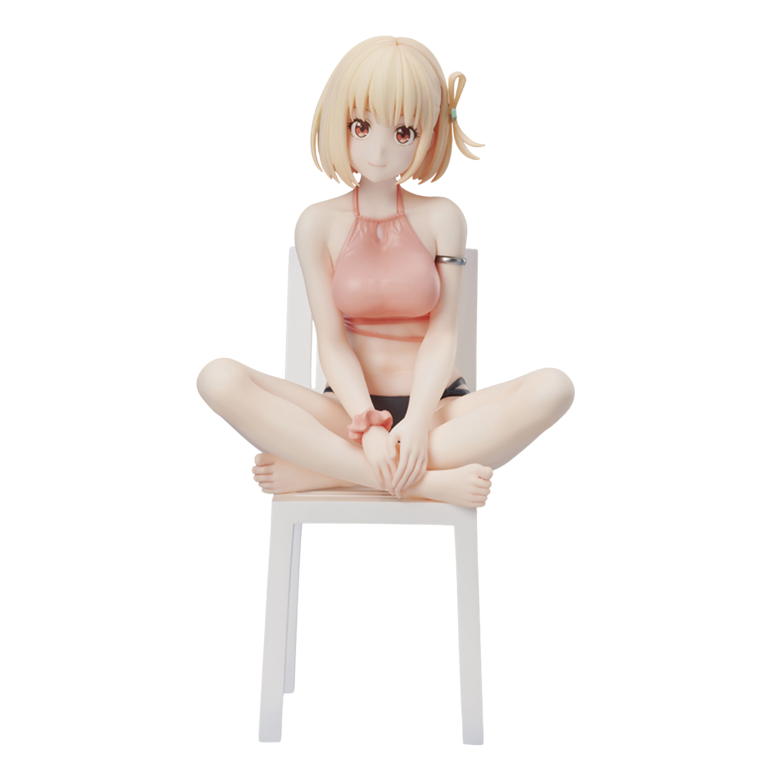 Anime character figurine sitting on a chair against a white background