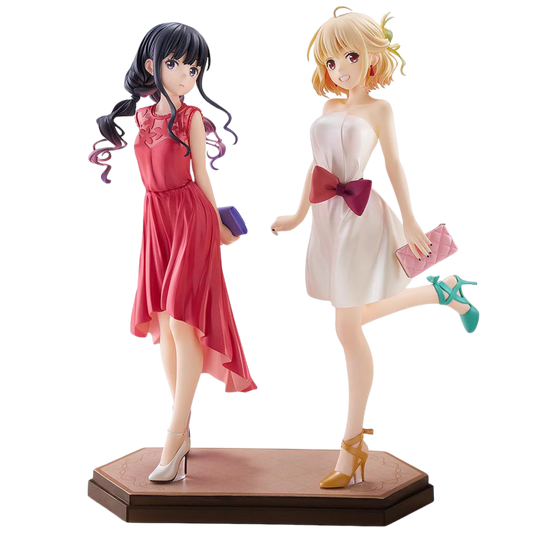 Two anime-style figurines of women in dresses on a white background