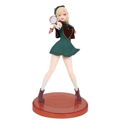 Figurine of a character in a green outfit with a magnifying glass on a white background