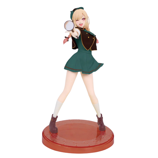 Figurine of a character in a green outfit with a magnifying glass on a white background
