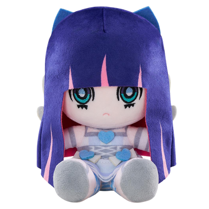 A plush doll with long purple hair, blue cat-ear-like side pieces, and large teal eyes, wearing a pale blue and white outfit with blue heart accents, photographed on a plain white background.
