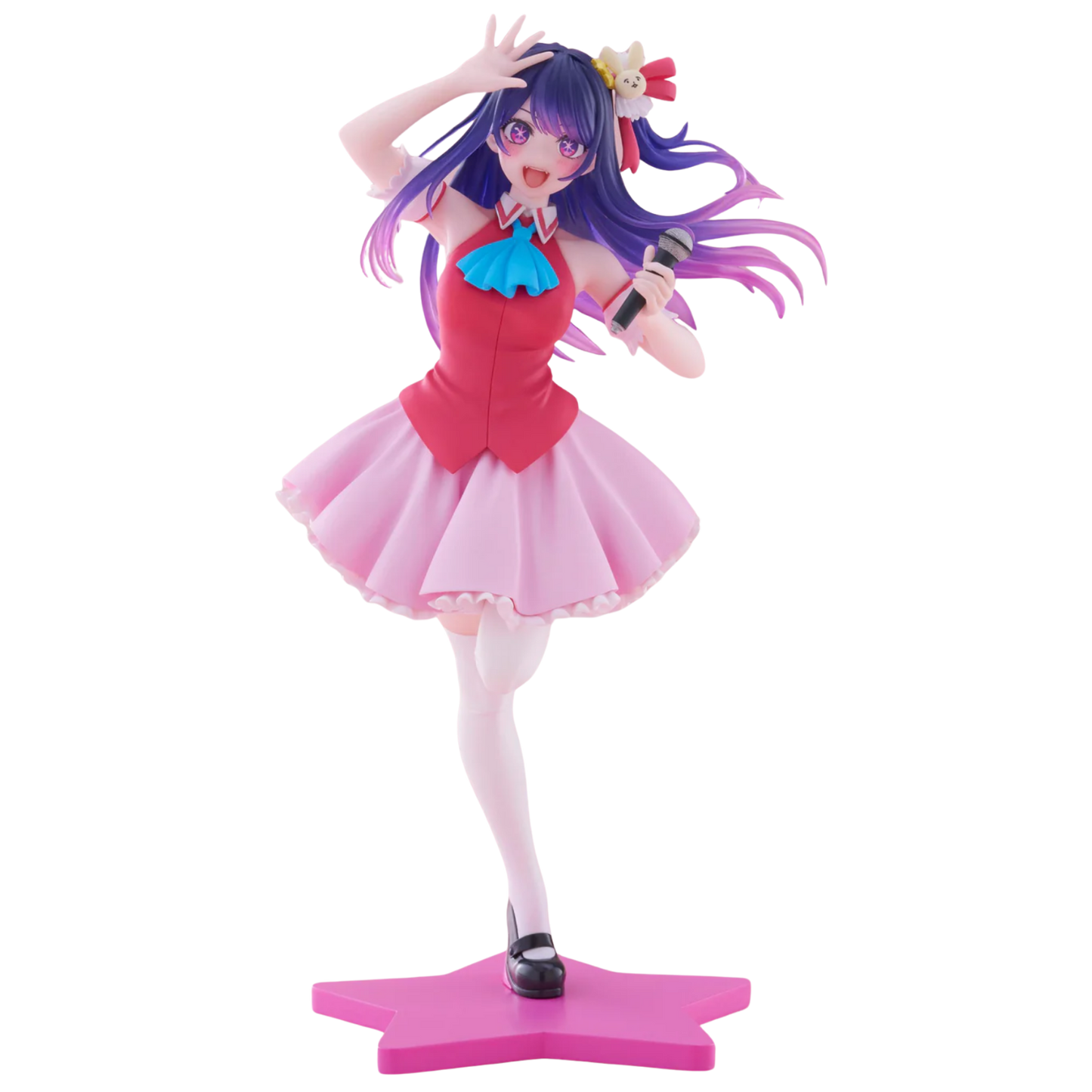 Figure of a character with purple hair and a pink outfit holding a microphone on a white background