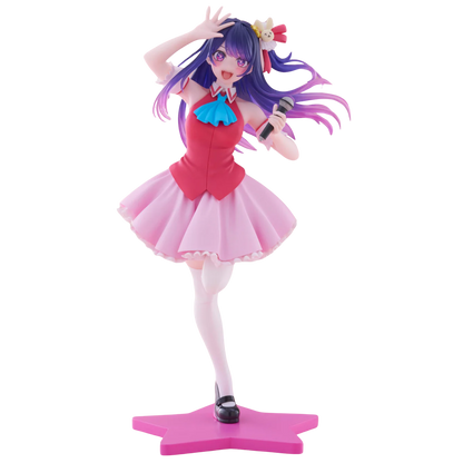 Figure of a character with purple hair and a pink outfit holding a microphone on a white background