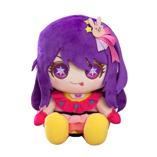 A purple-haired anime plush doll with star-shaped eyes, wearing a pink outfit and yellow shoes, set against a plain white background.