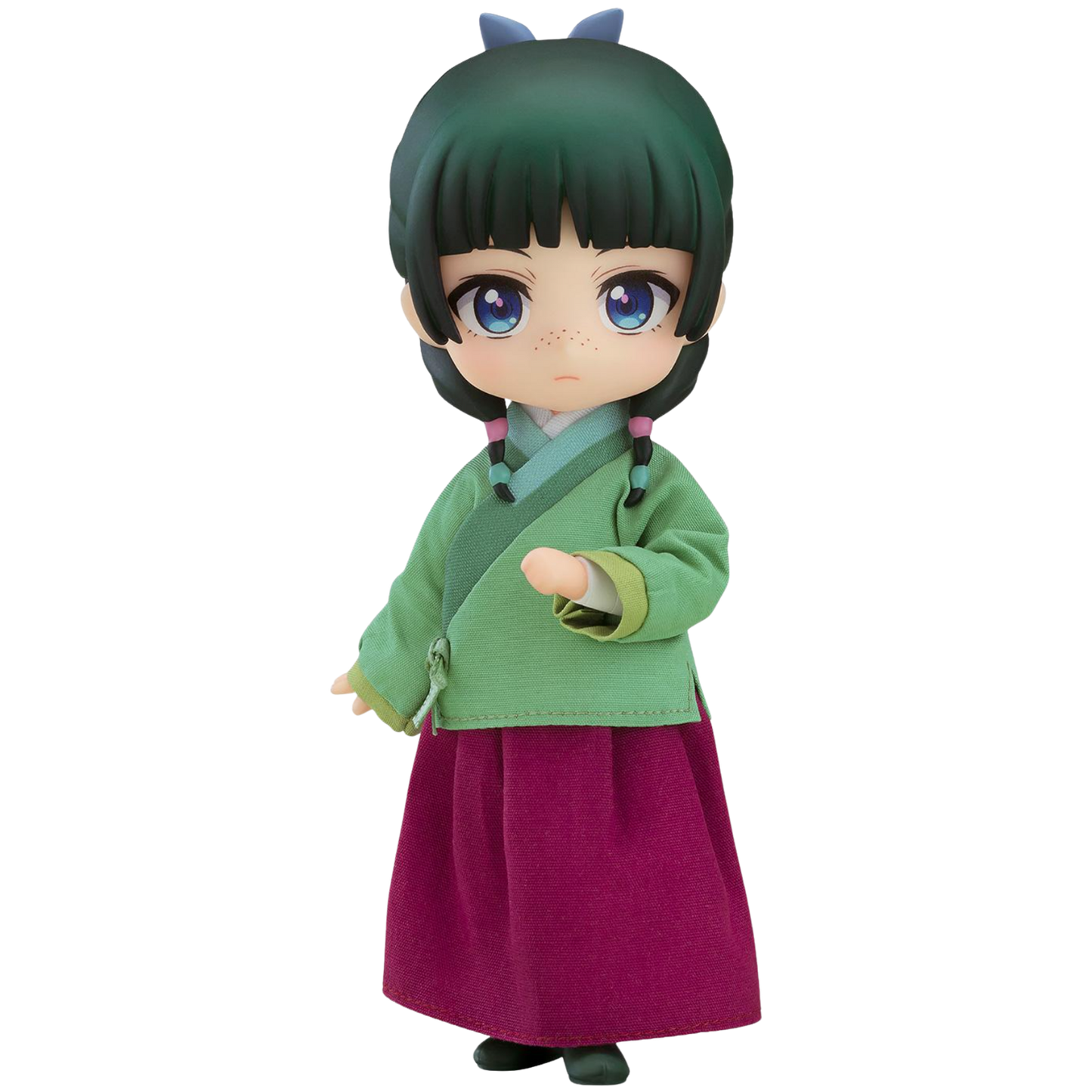 Toy figure of a character in green top and purple skirt on a white background