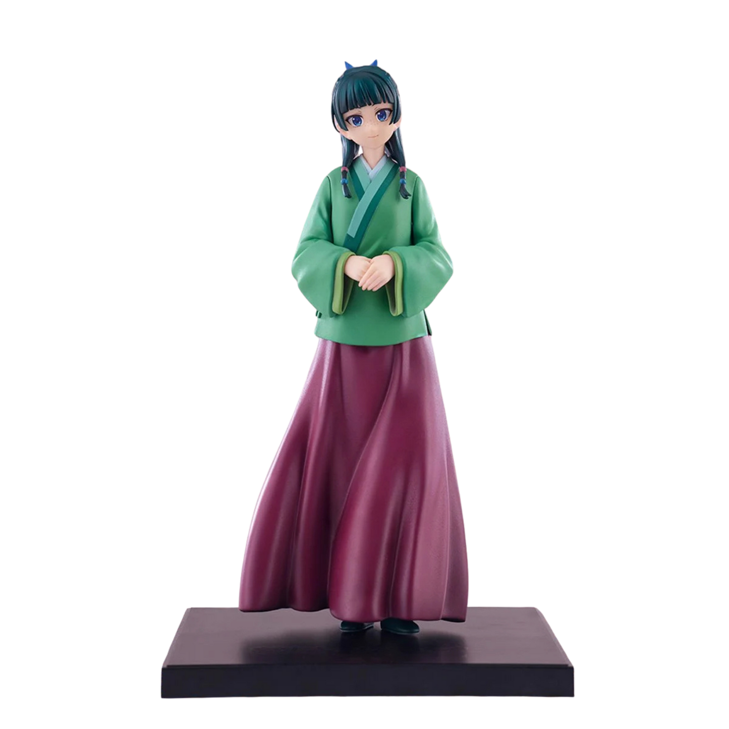 Figurine of a character in green top and purple skirt on a white background