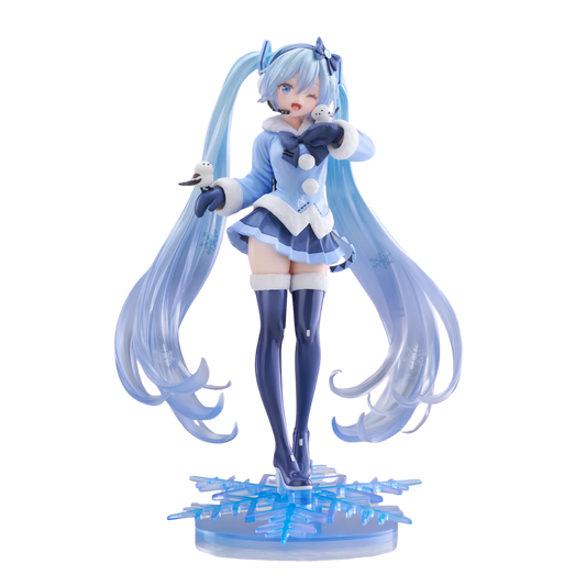 A collectible anime figurine of Hatsune Miku in a winter theme, featuring long icy blue twin-tails, a light blue and white outfit, dark blue thigh-high stockings, and a translucent blue snowflake base, shown against a plain white background.