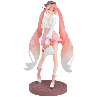 Anime character figurine with long pink hair and a white outfit on a white background
