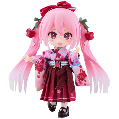 Anime character figurine with pink hair and cherry decorations on a white background