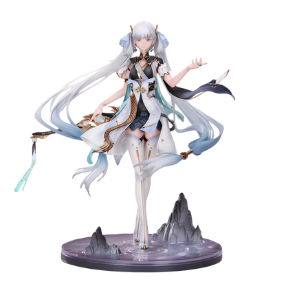A detailed anime-style figurine of a female character with long white and blue hair, wearing a white and black outfit with teal accents, posed dynamically on a circular base with small gray mountain shapes.