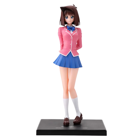 Figure of a character in a pink jacket and blue skirt on a white background