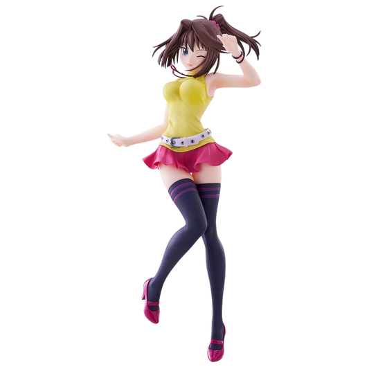 Anime character figurine in a yellow top and pink skirt on a white background